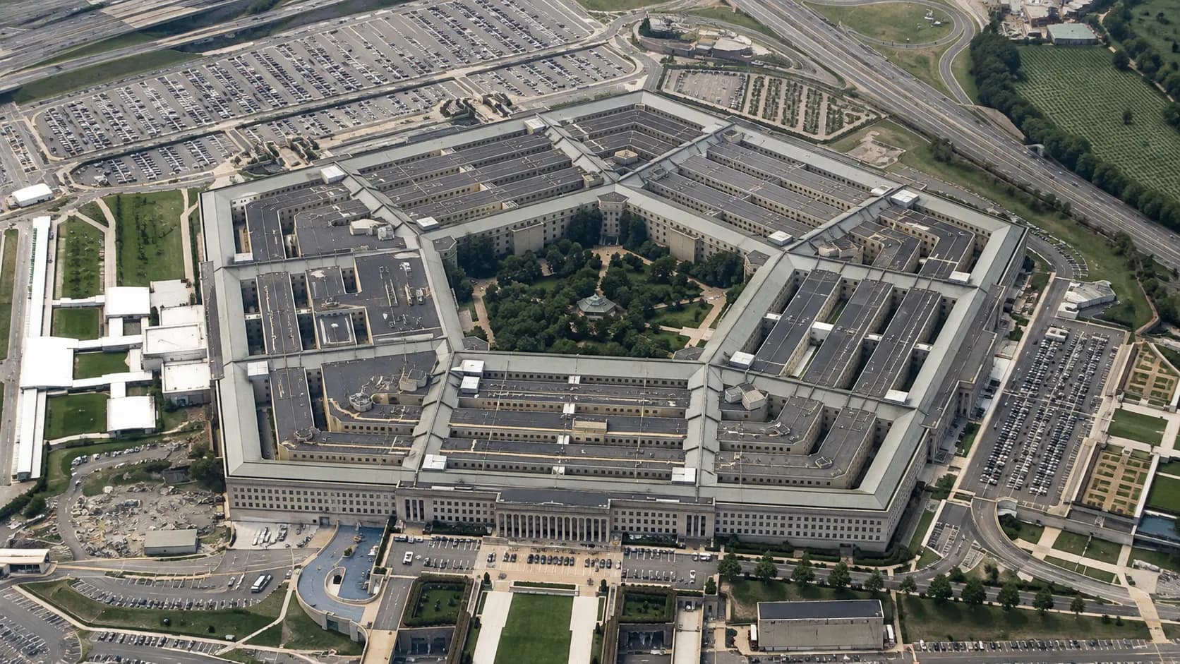 A site-plan illustration showing the early Pentagon design fitted within the five-road layout at Arlington Farms.